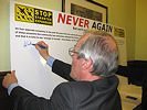 Sir Alan Haselhurst, MP for Saffron Walden, signing the SSE 'Never Again' pledge at the House of Commons reception on 15 July 2010